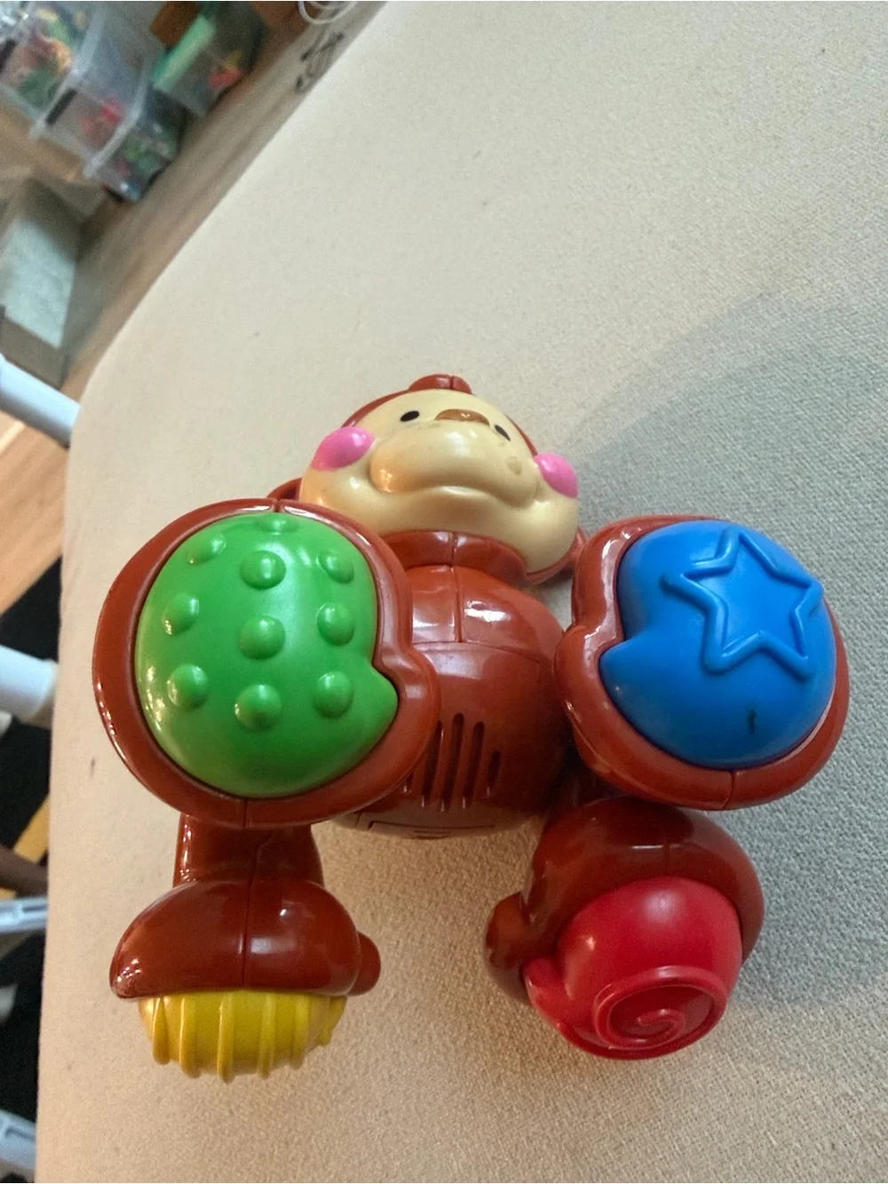 Fisher-Price Red Monkey Push Toy with Blue and Green Rollers